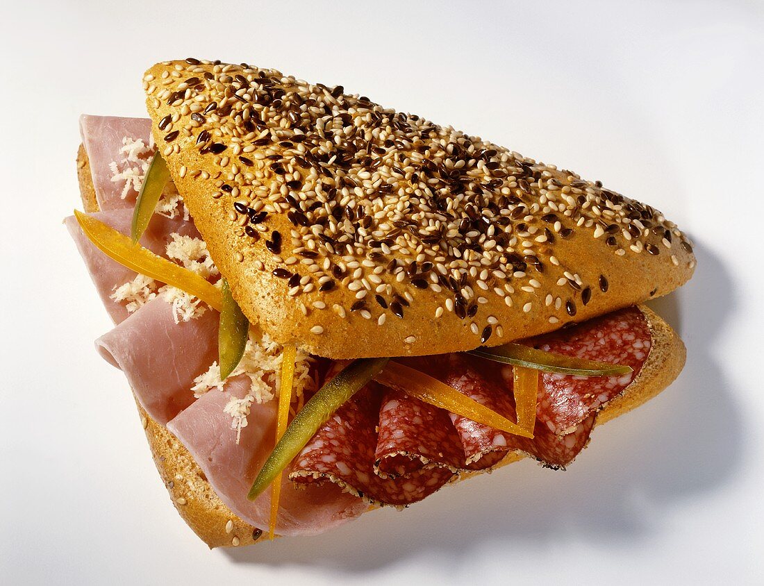 Sesame roll filled with ham and salami