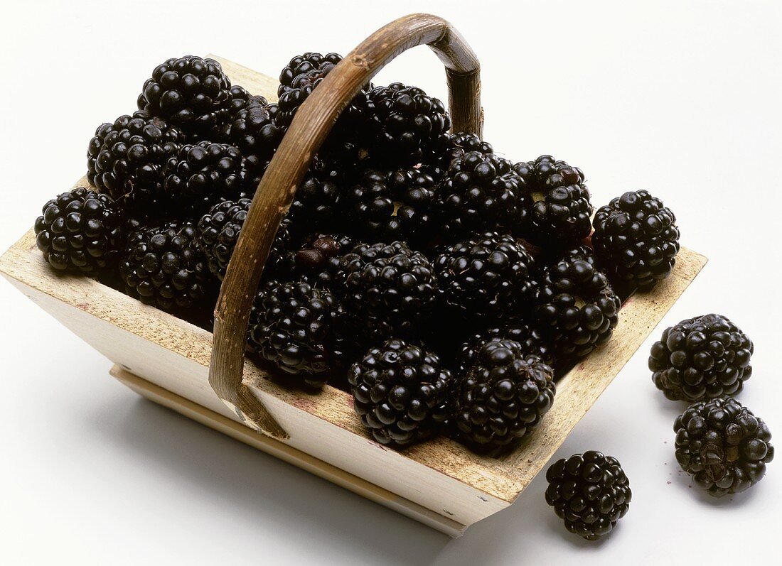 Blackberries in small wooden basket