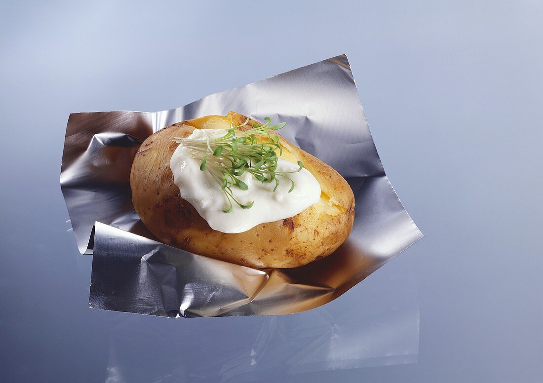 Baked potato with sour cream and cress