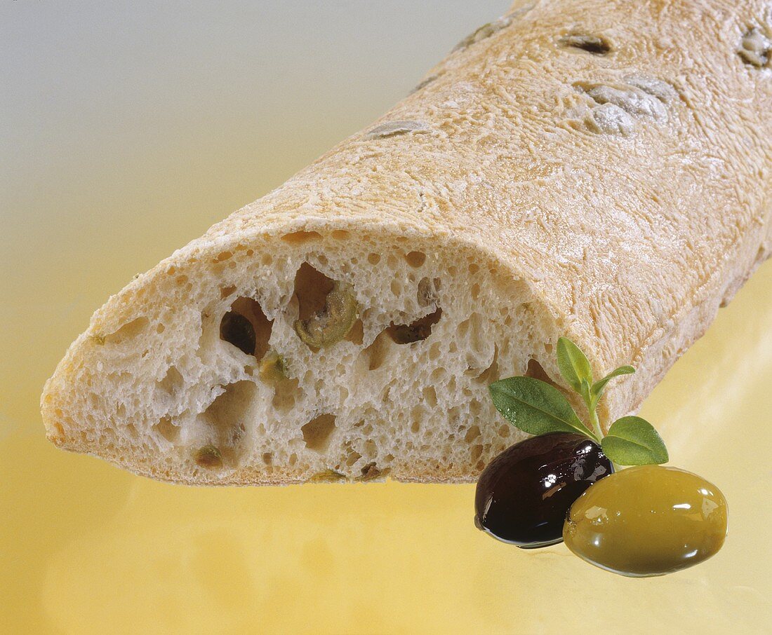 Ciabatta with olives, slices removed