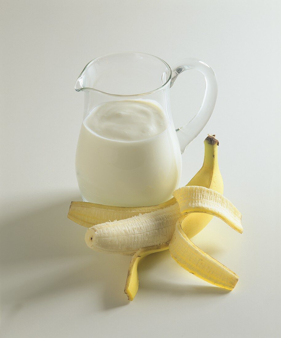 Banana kefir drink in glass jug
