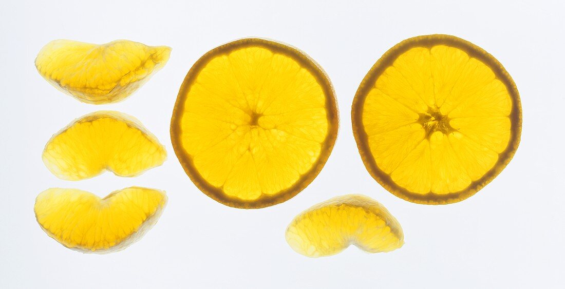 Orange slices and pieces, backlit