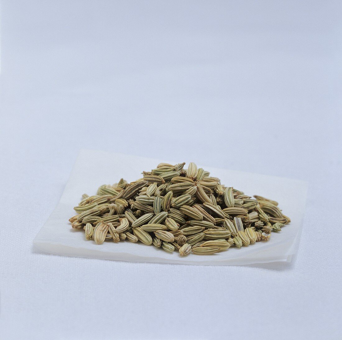 A heap of fennel seeds