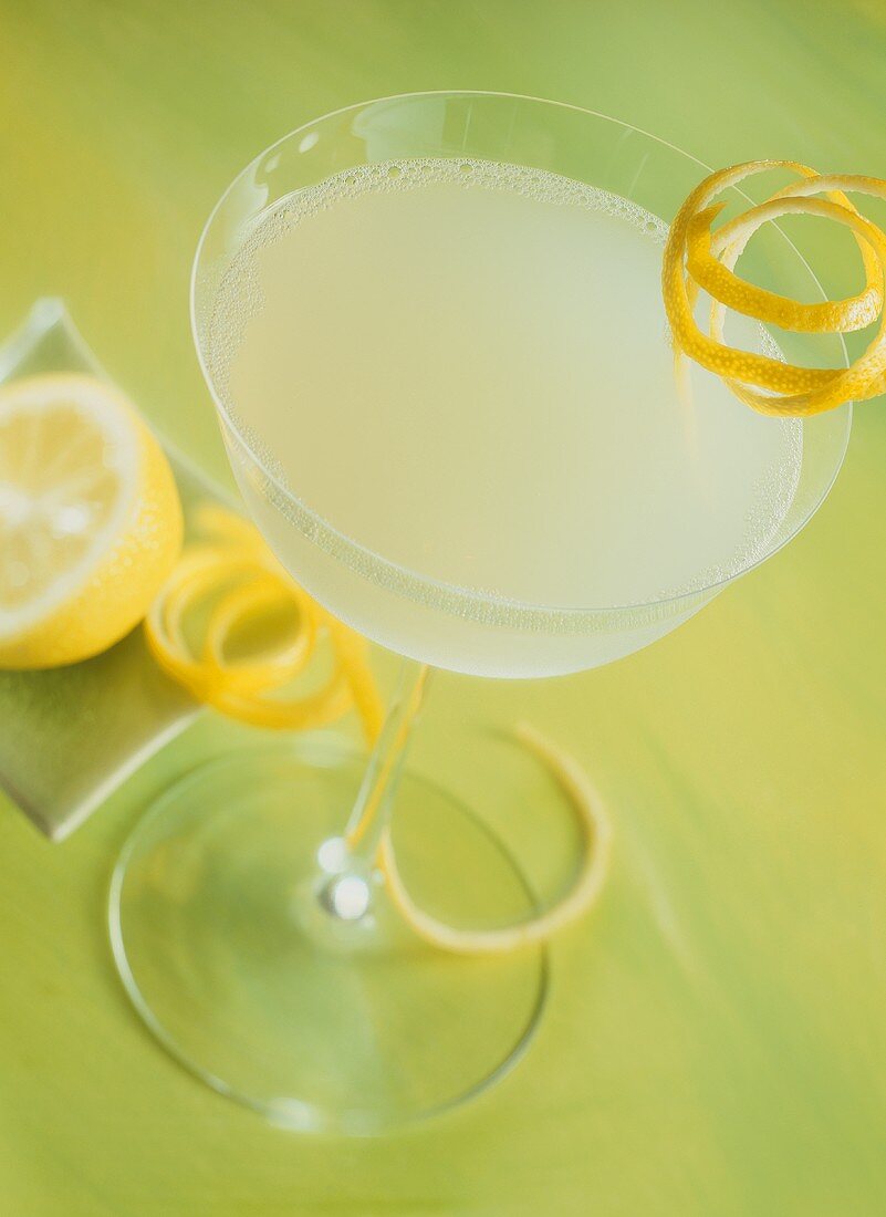 Cocktail with lemon in cocktail glass