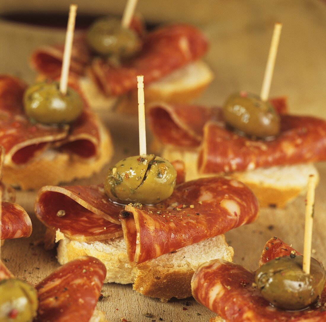 Canapés with chorizo and green olives