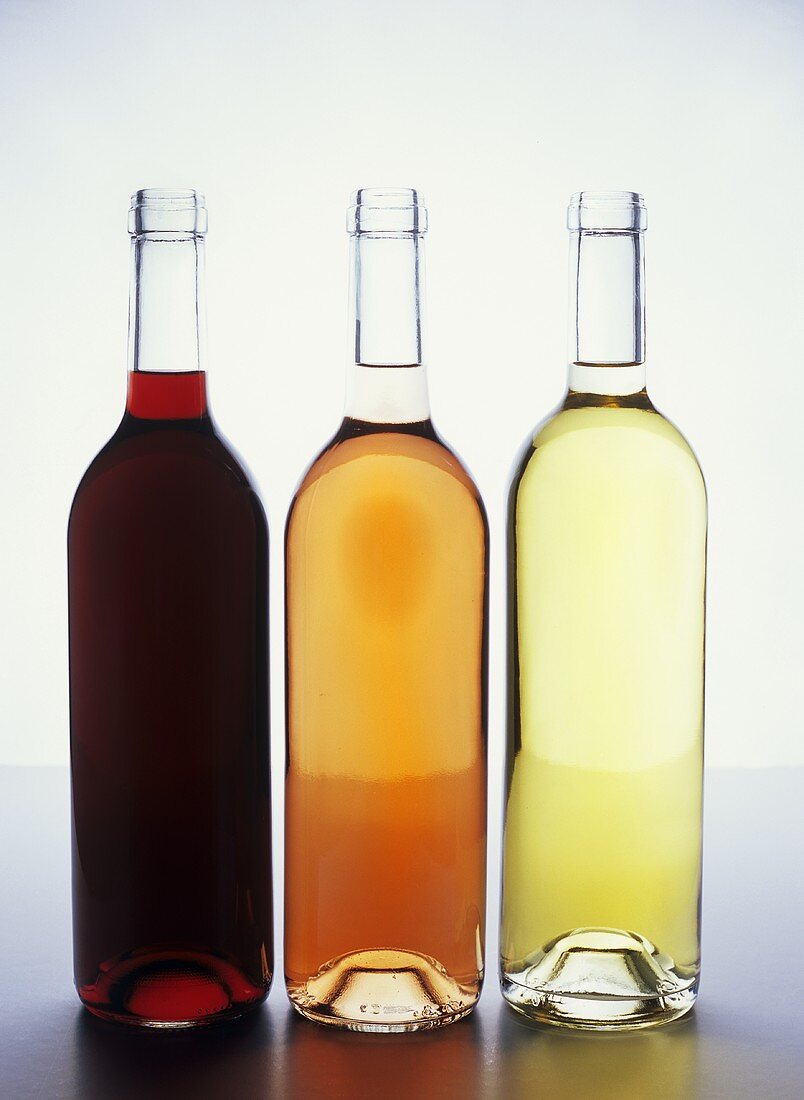 Three bottles of wine: red, rosé and white