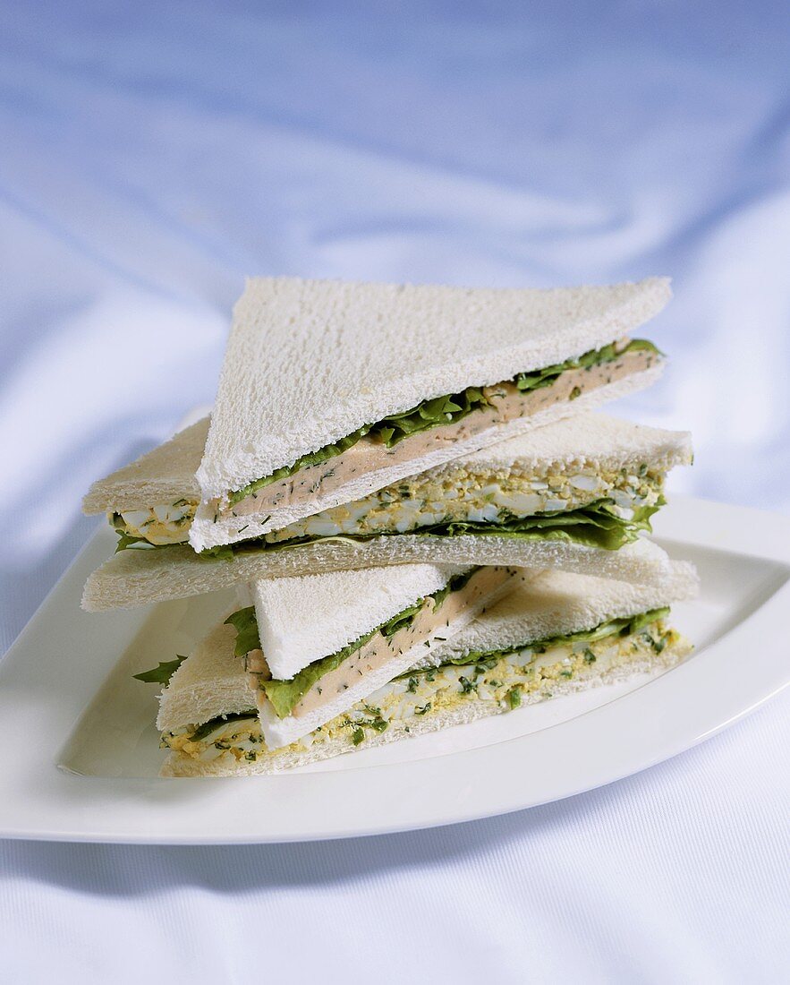 Egg and lettuce sandwiches and salmon spread sandwiches