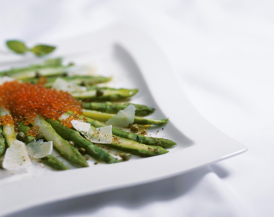 Green asparagus with caviar, capers and Parmesan