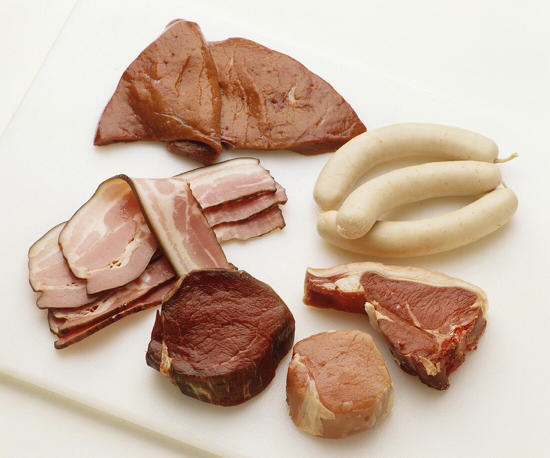Various types of meat, sausages, bacon and liver