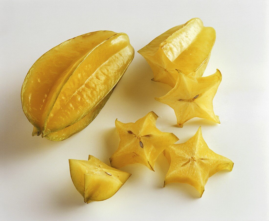Carambolas, one whole and one sliced