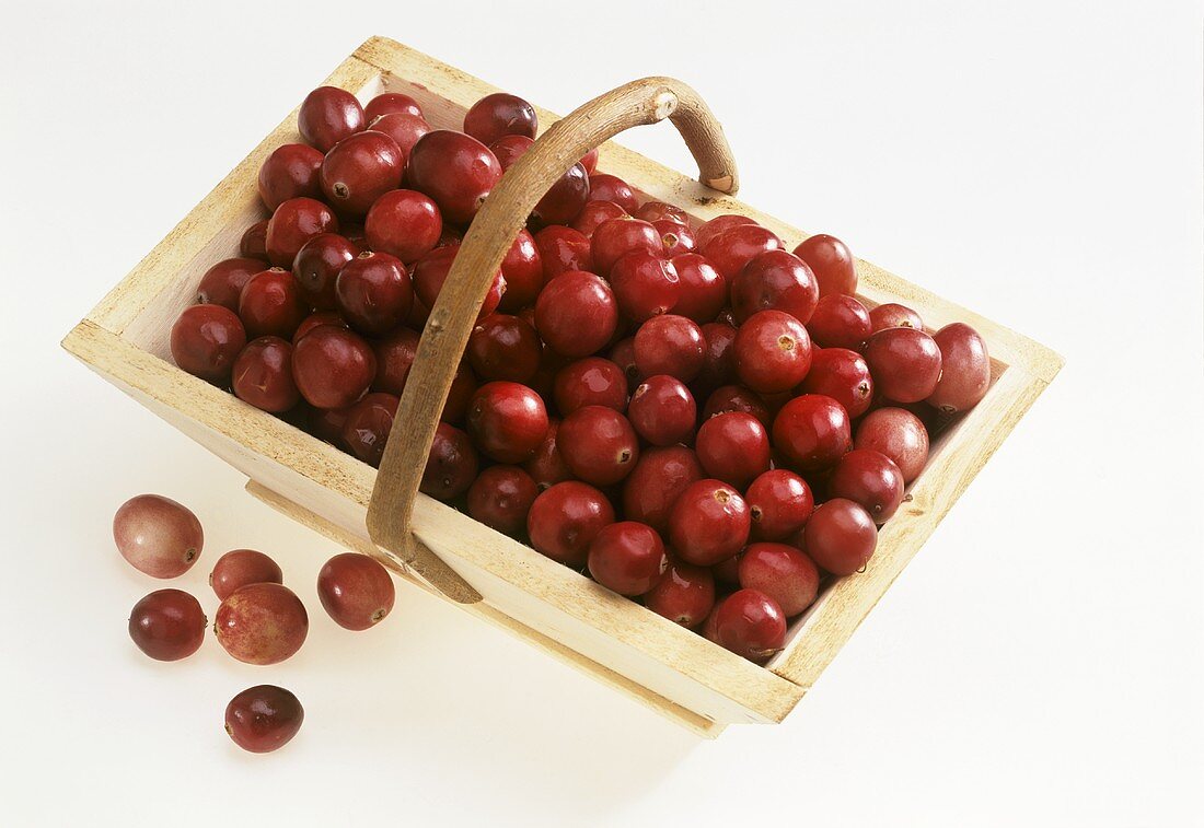 Fresh cranberries in a wooden basket