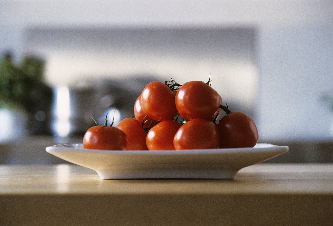 Tomatoes in dish on kitchen table