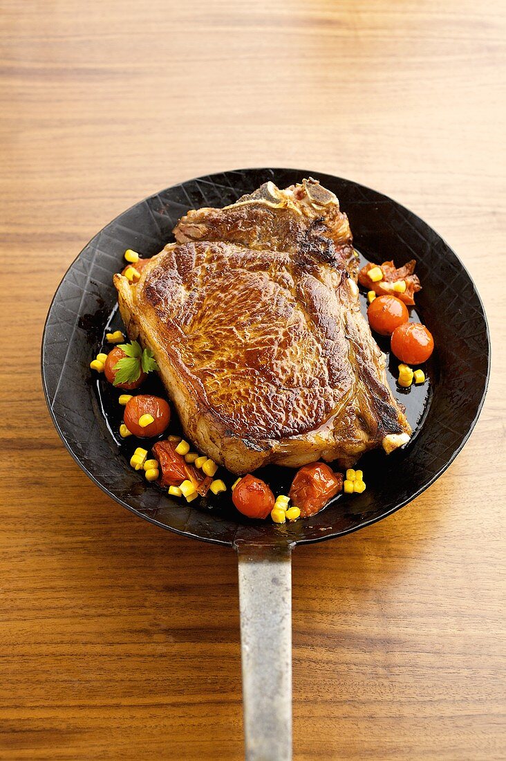 Beefsteak with vegetables in frying pan