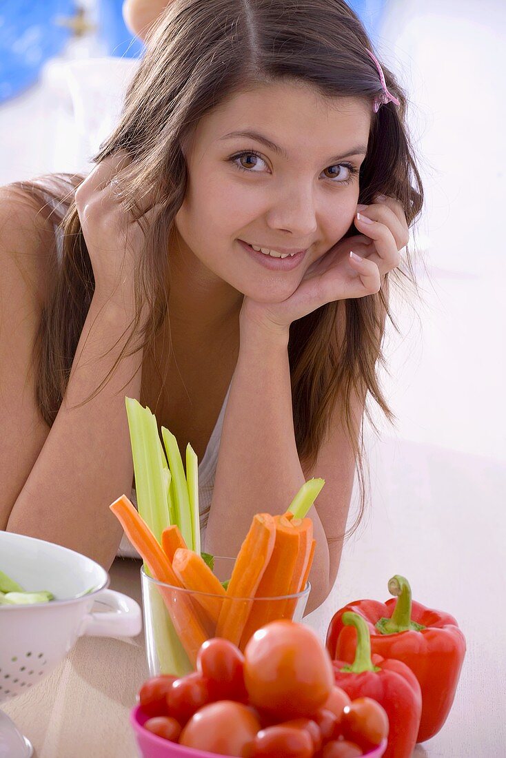 Girl with fresh vegetables