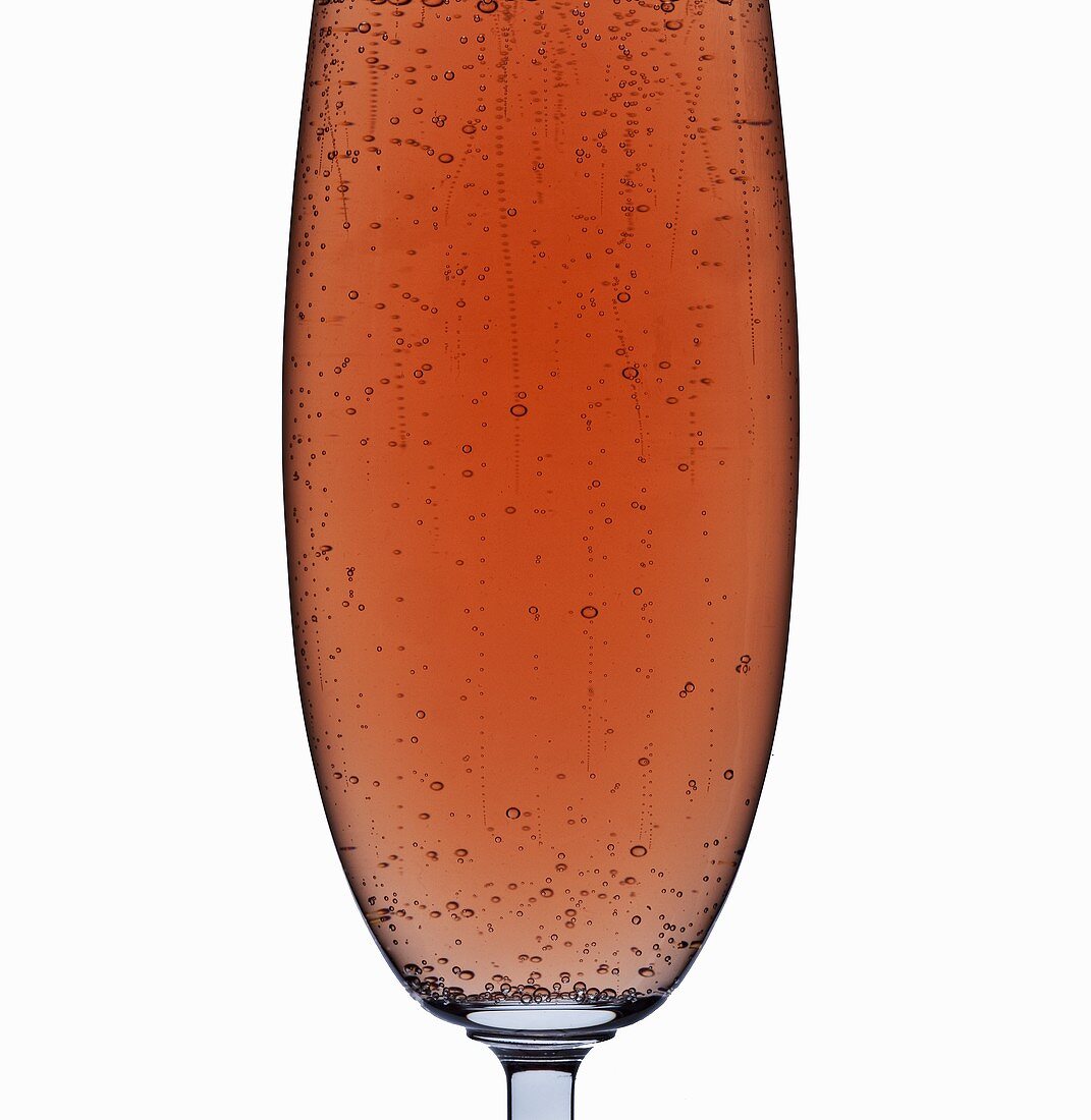 A glass of rosé sparkling wine (detail)