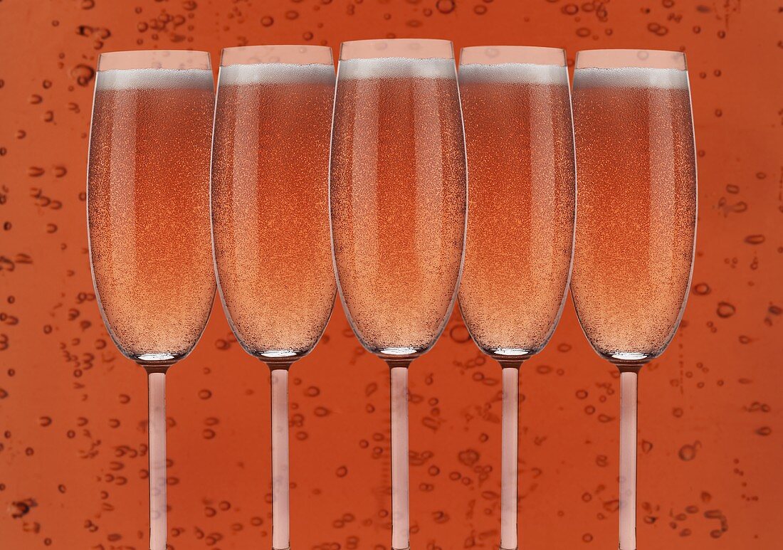 Several glasses of rosé sparkling wine