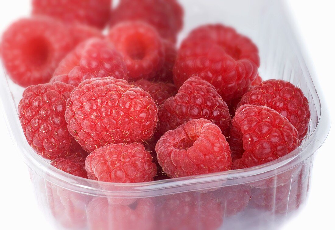 Fresh raspberries in a plastic punnet