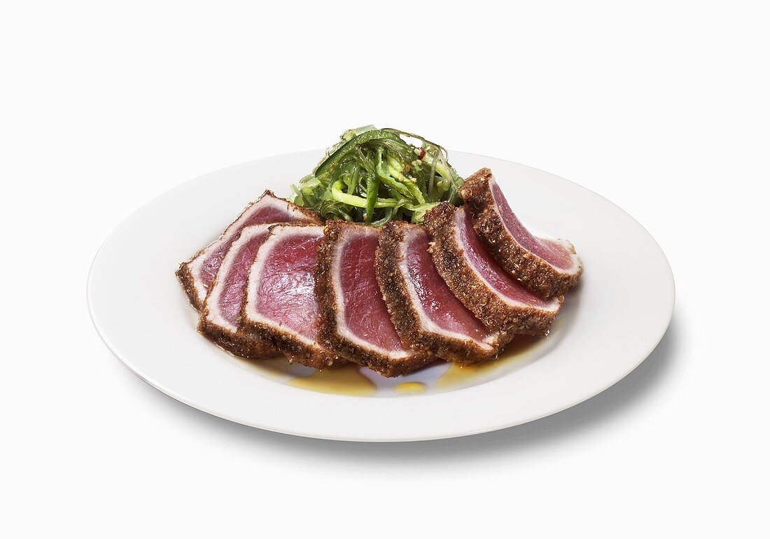 Sliced Seared Tuna on a Plate; White Background