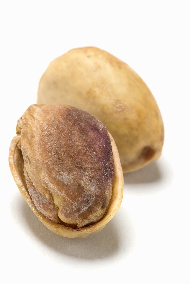 Unopened and opened pistachios