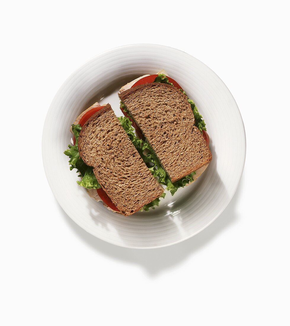 Turkey, Lettuce and Tomato Sandwich on Whole Wheat Bread; From Above