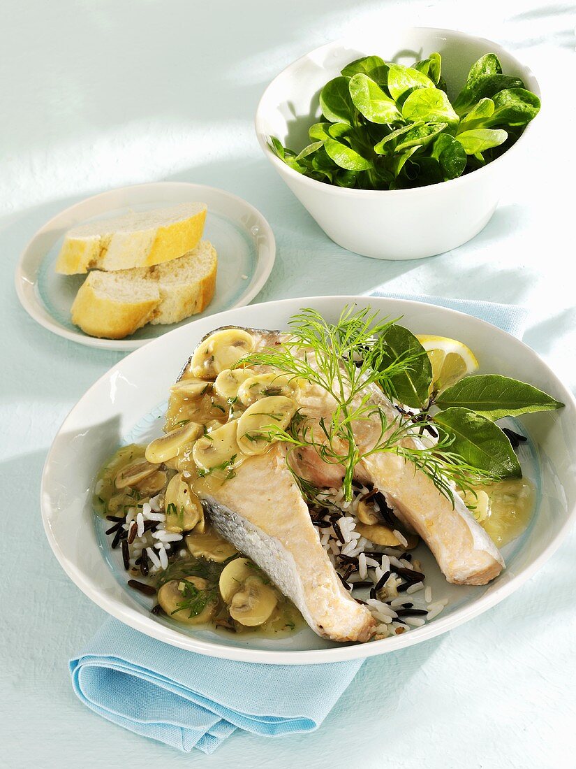 Salmon steak in dill and mushroom sauce on wild rice