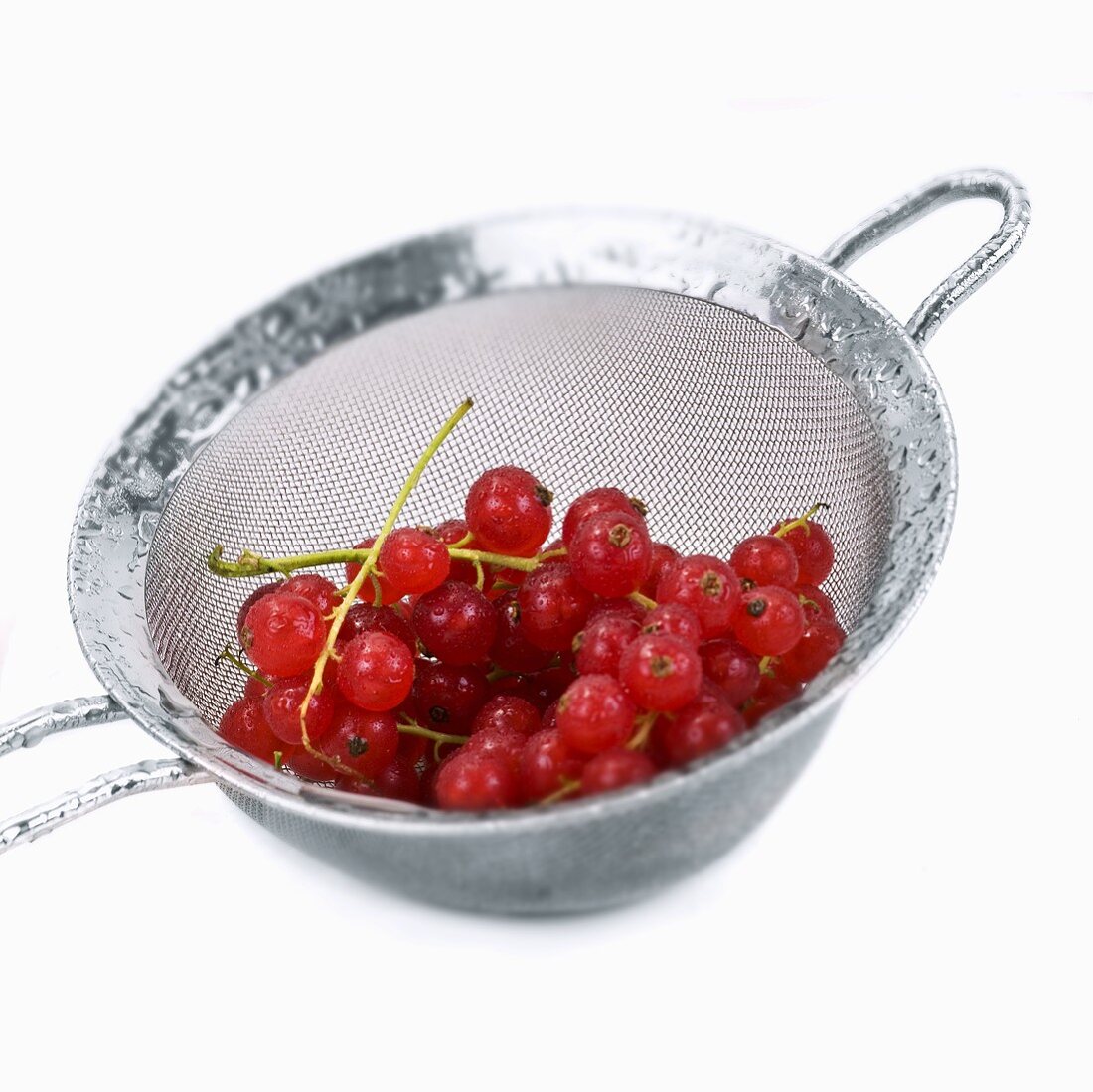 Freshly washed redcurrants in a sieve