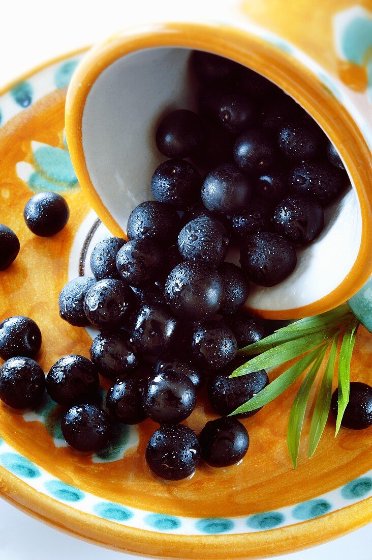 Acai berries in an upturned bowl