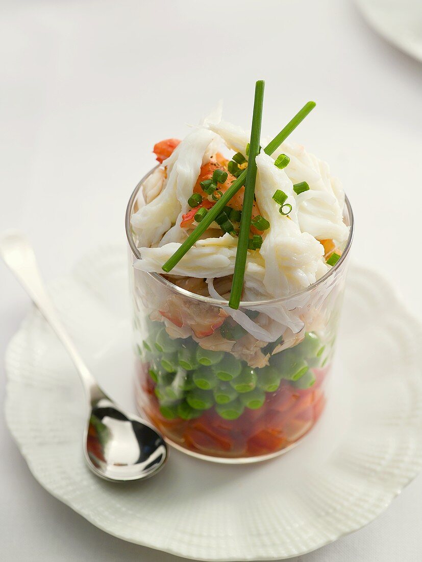 Crab and vegetable salad in a glass