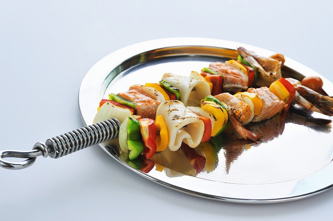 Grilled seafood and vegetable kebabs