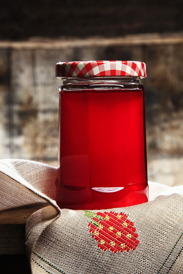 Red fruit jelly in a jar