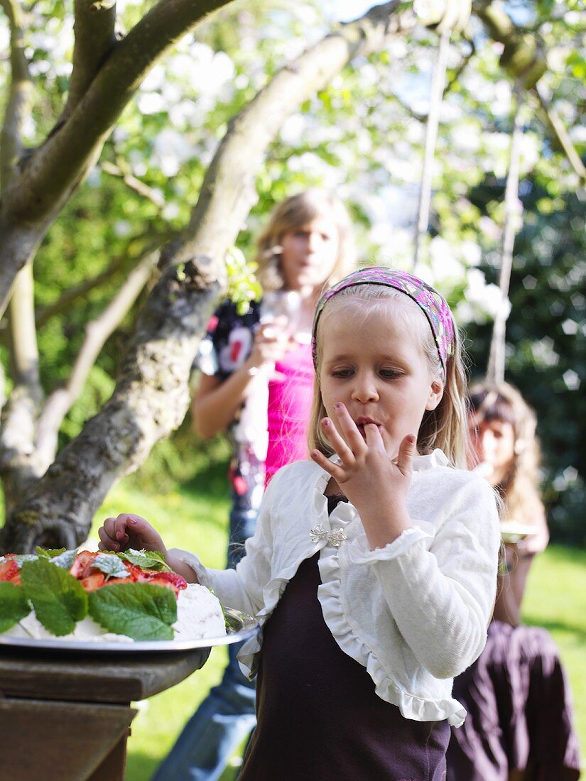 Children at buffet in garden (Sweden)