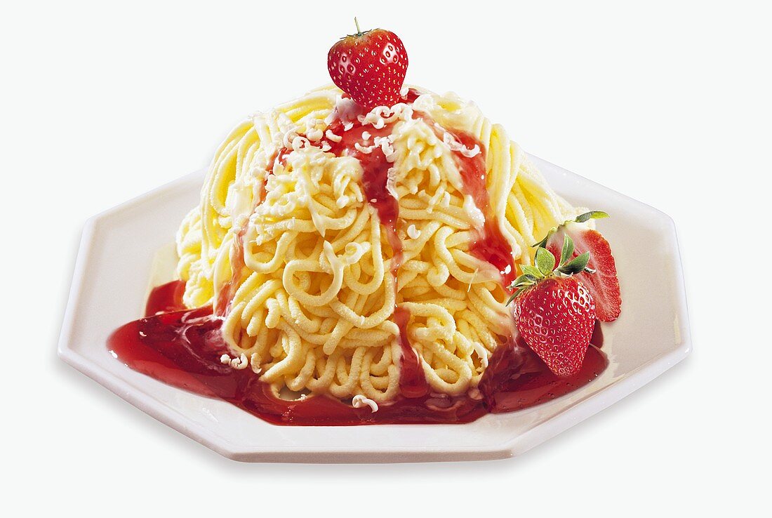 Spaghetti ice cream with strawberries and fruit sauce