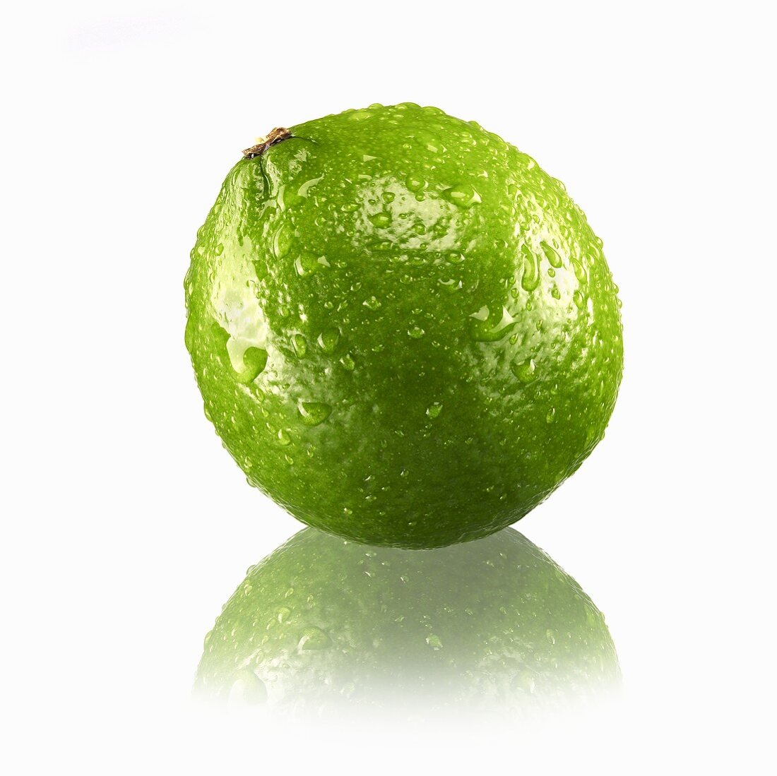 Lime with drops of water and reflection