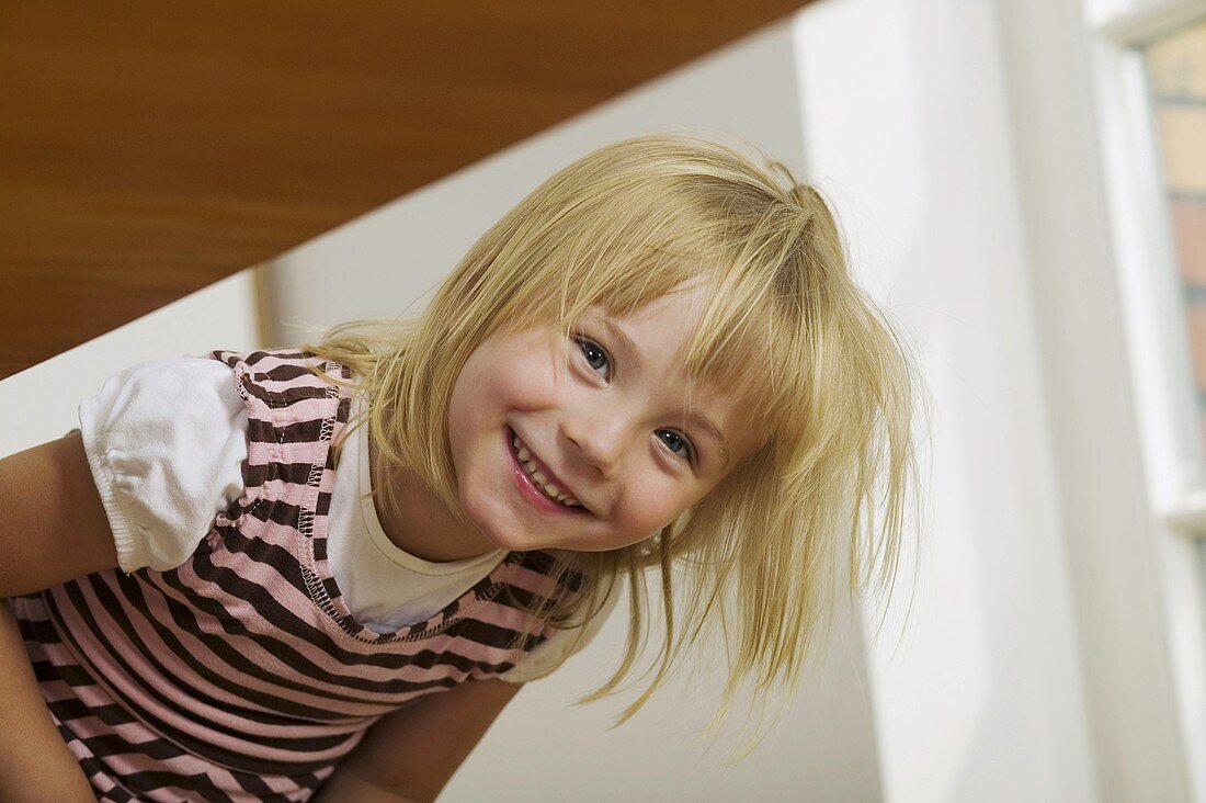 Blond girl smiling for camera