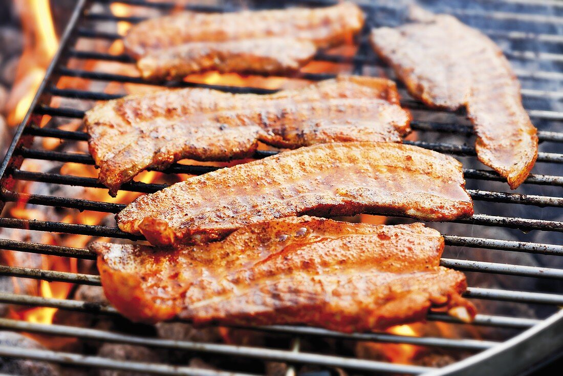 Marinated belly pork on barbecue