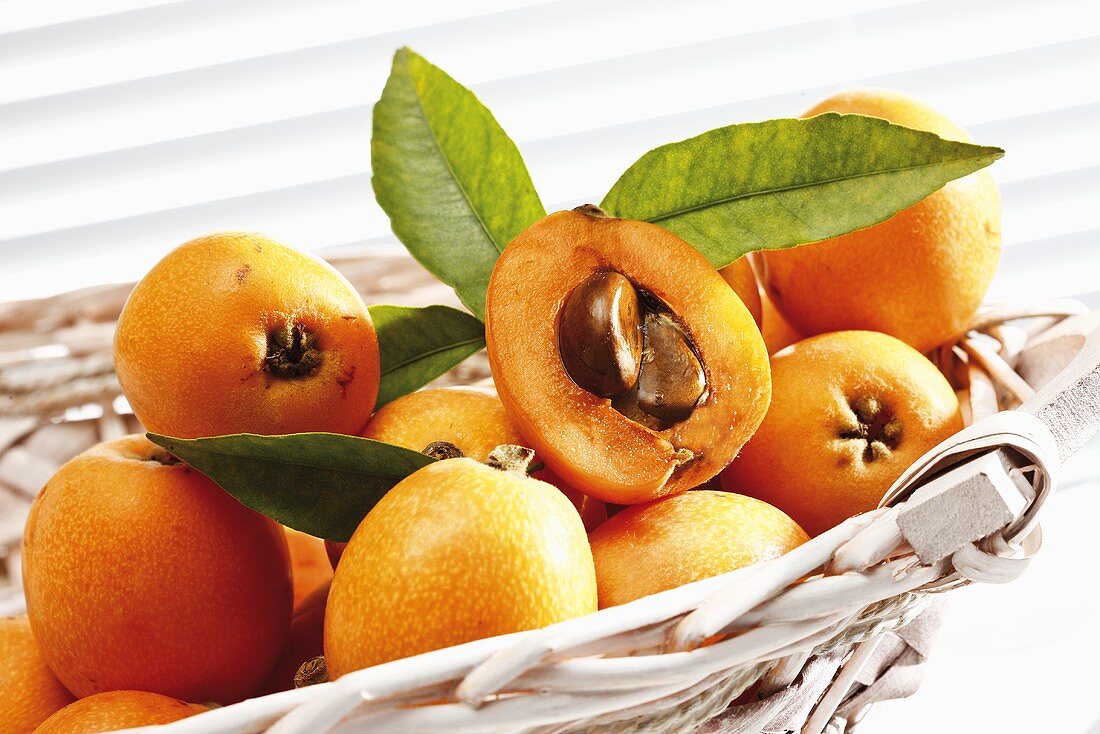 Medlars with leaves in basket