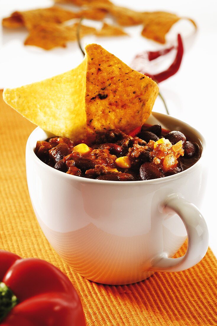 Chili con carne in cup with tortilla chips