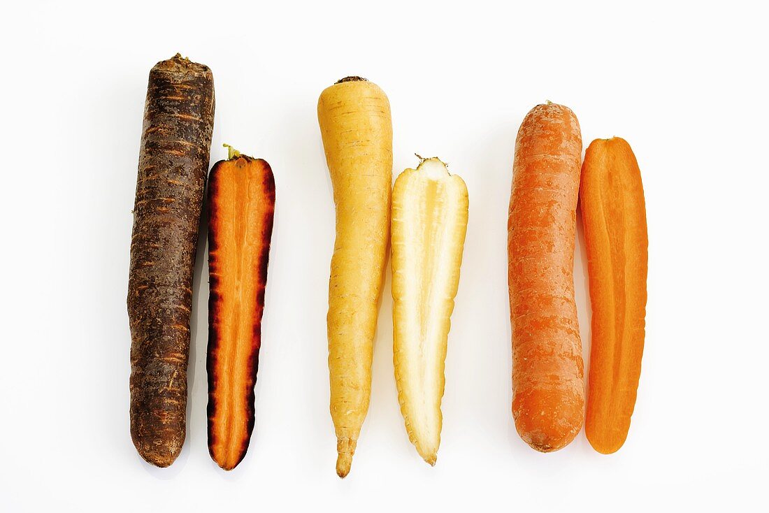 Various types of carrots, whole and halved