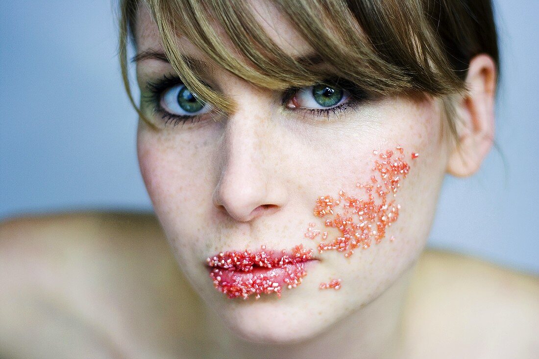 Young woman with sugar smeared face