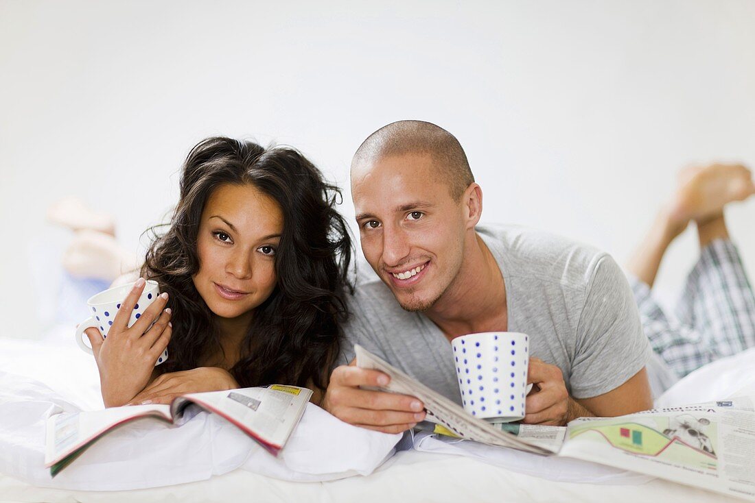 Man and woman lying in bed