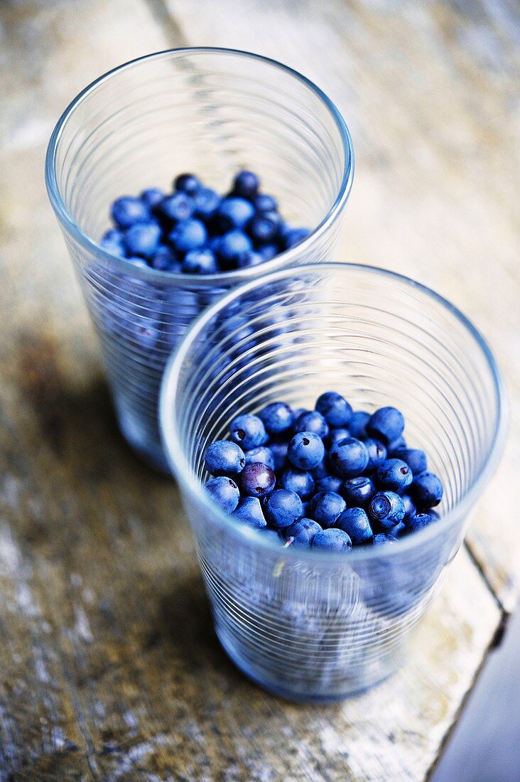 Blueberries in two beakers
