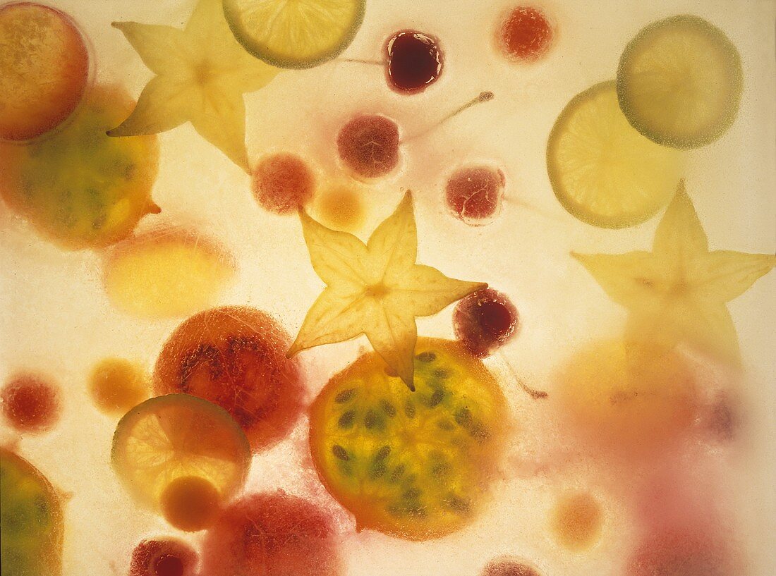 Halved exotic fruit under sheet of glass