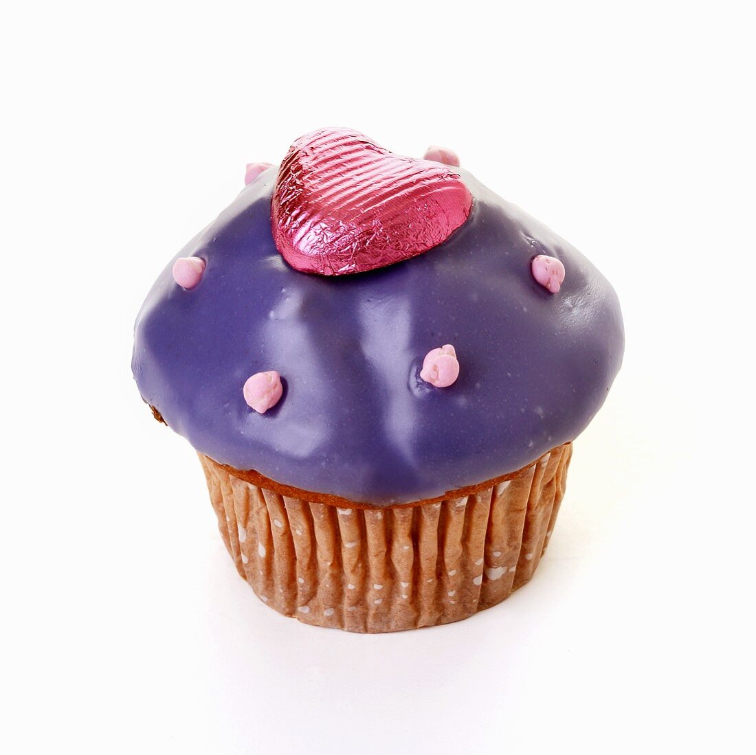 Muffin with purple icing and chocolate heart