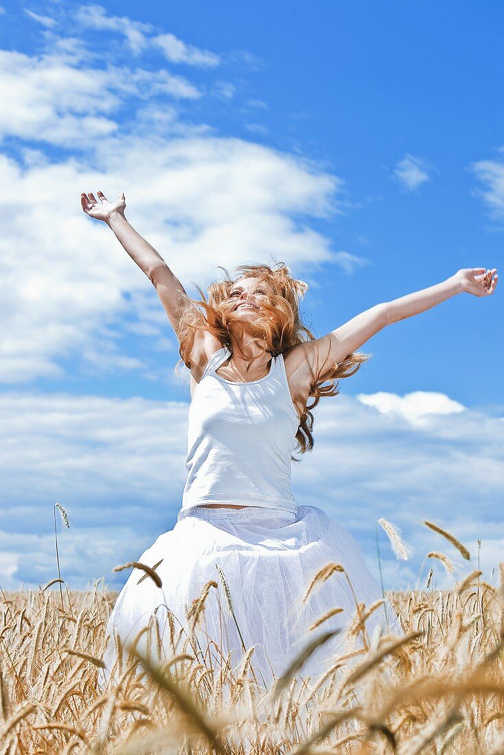 Young woman in barley field