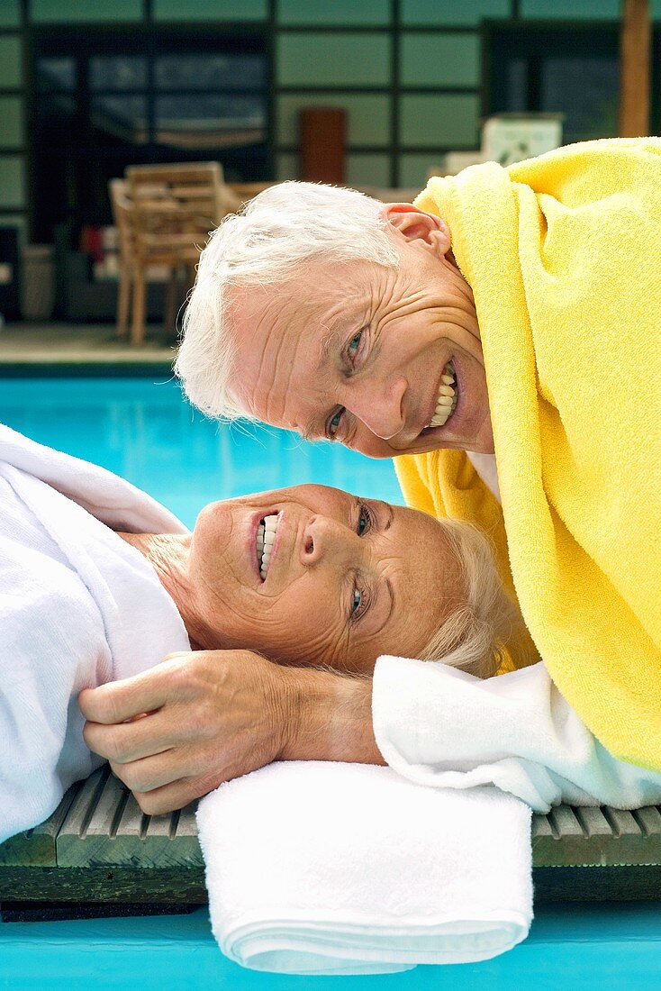 Germany, Senior Couple Relaxing on jetty