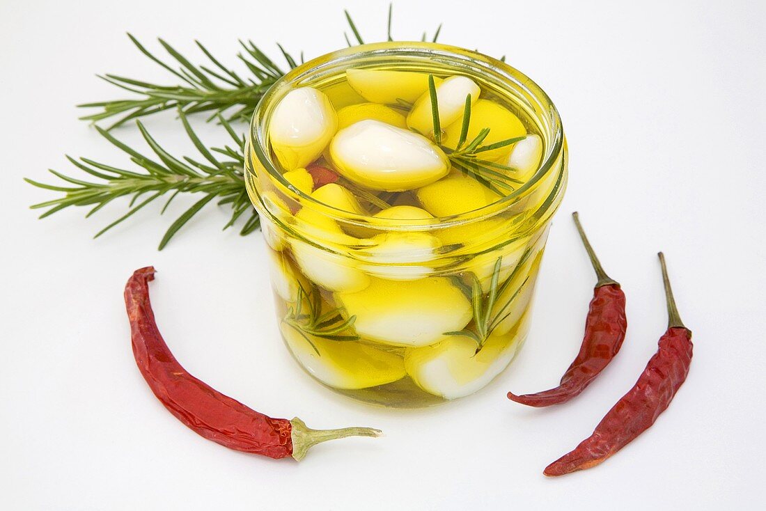 Pickled garlic with rosemary, dried chillies
