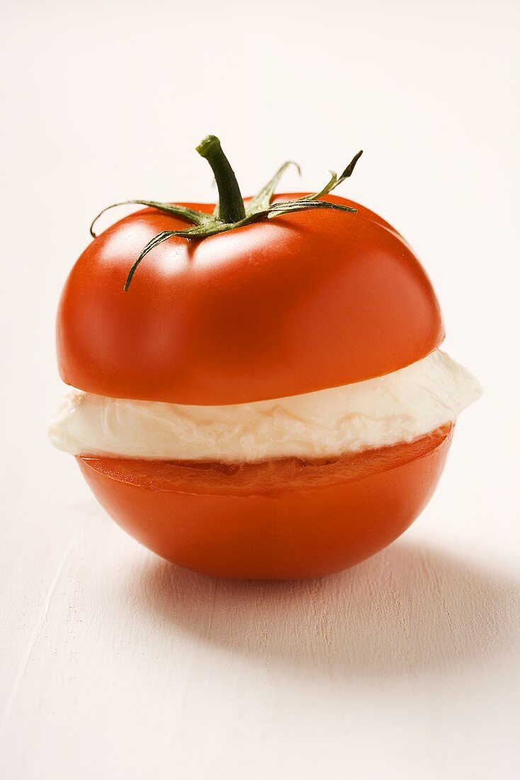 Tomato with a slice of mozzarella