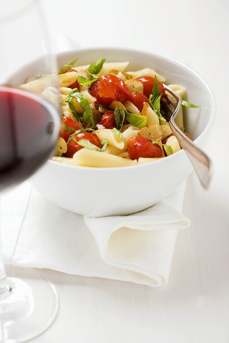 Penne with cherry tomatoes, basil and garlic