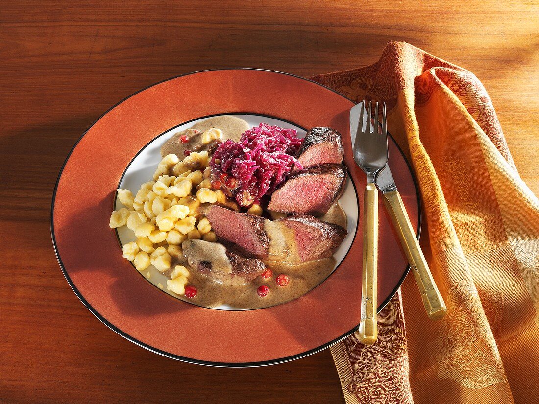 Hare loin fillet in cranberry sauce with spaetzle & red cabbage