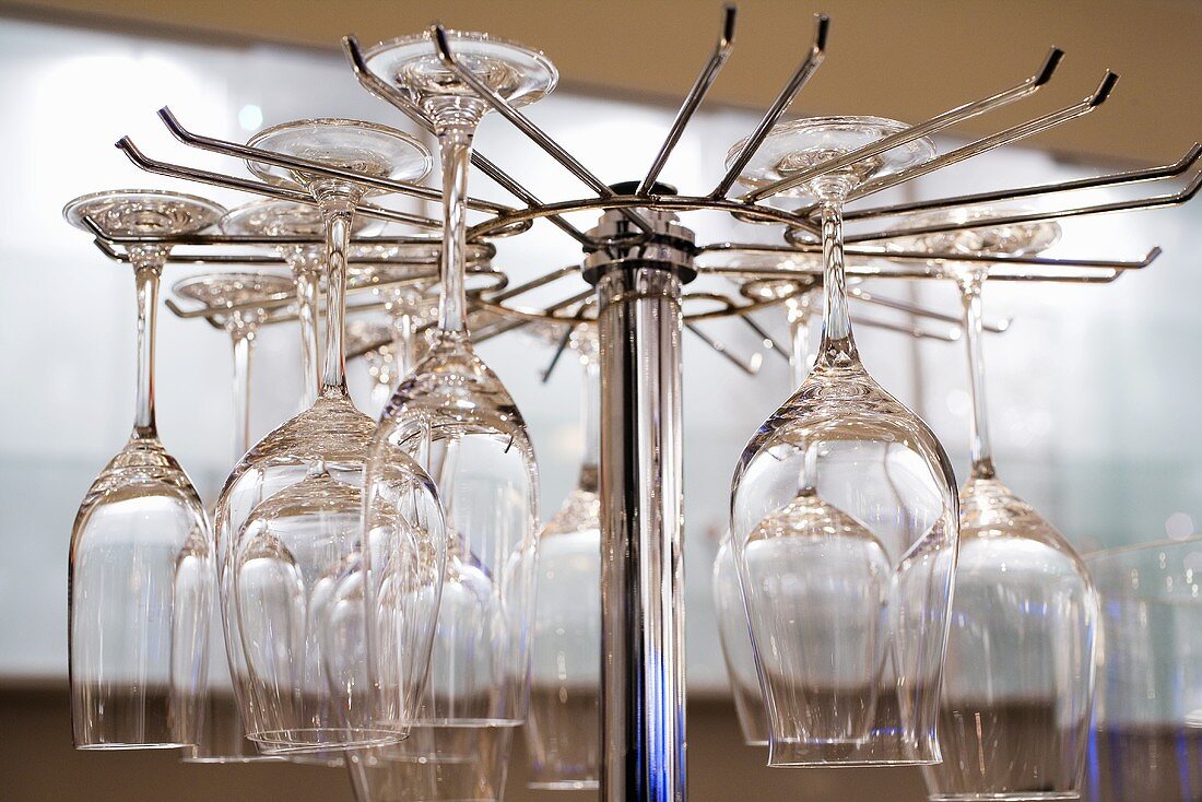 White wine glasses hanging on a stand